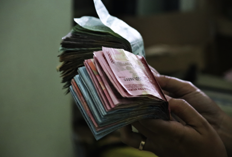 Ilustrasi uang rupiah untuk penukaran saat lebaran 2025.